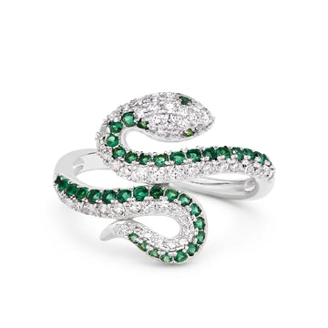Coiled moissanite snake ring in 925 sterling silver with a white gold finish, pavé moissanite and a row of green lab-created emeralds along the body, on a white background - Sensitive Stones