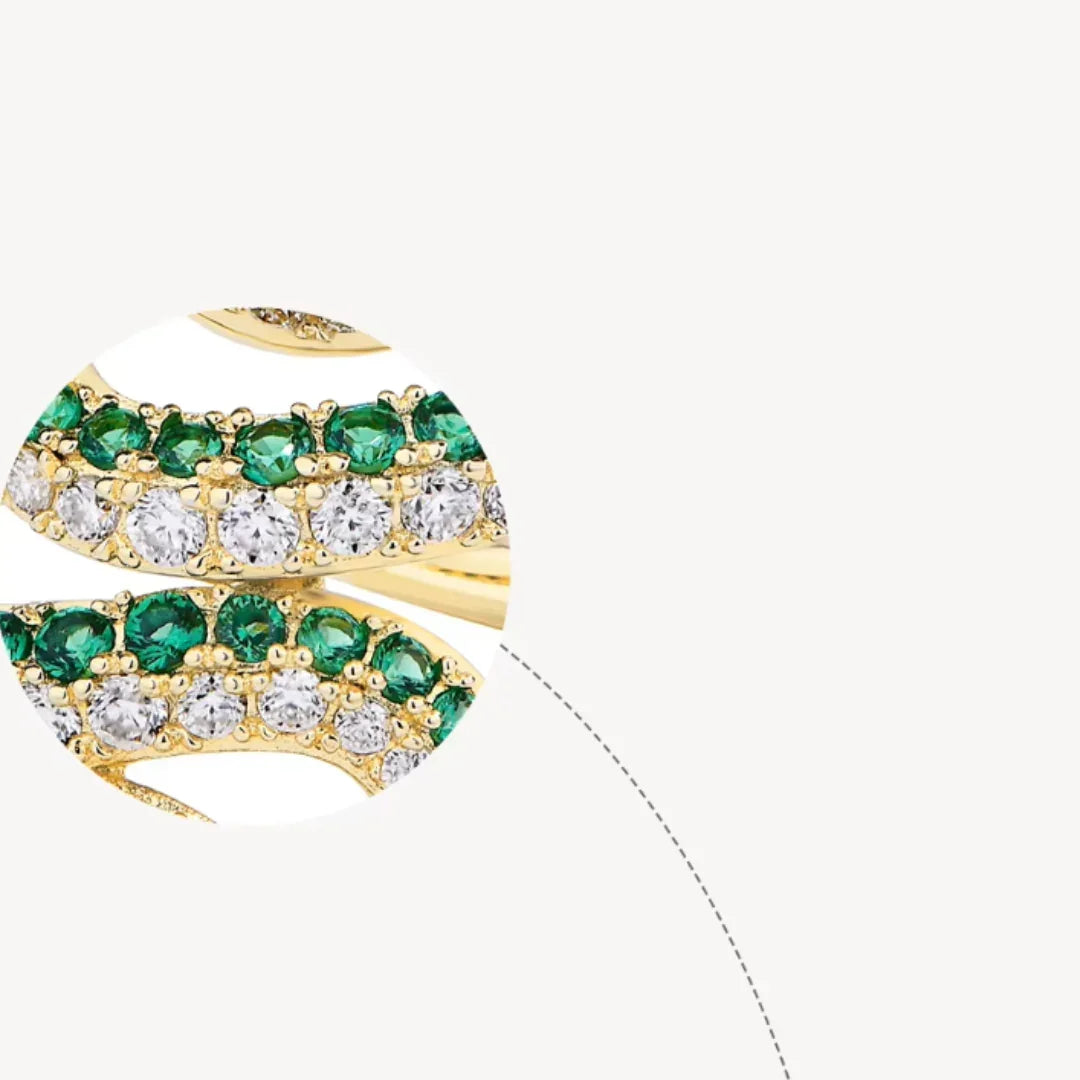 Close-up of moissanite and green nano gemstones on gold coiled snake ring | Sensitive Stones
