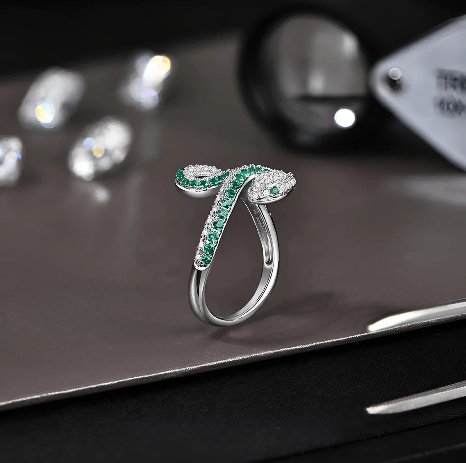 Silver moissanite coiled snake ring with green gemstone accents, pavé setting | Sensitive Stones
