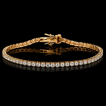 Dainty moissanite tennis bracelet on a black reflective surface, showing square D Color VVS1 stones in four-prong settings - Sensitive Stones