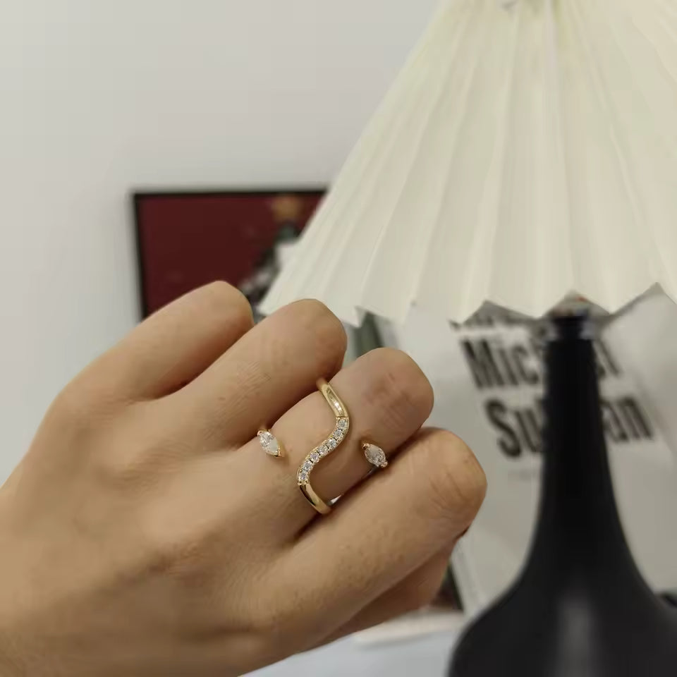 Double Snake Moissanite Ring, D Color VVS1 moissanite shown on hand with lamp and modern decor - Sensitive Stones