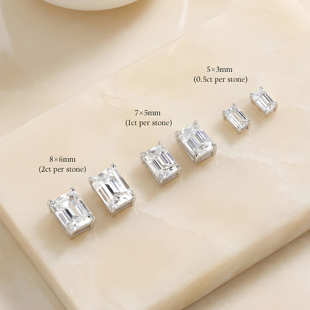 Emerald cut moissanite stud earrings size chart showing 5x3mm, 7x5mm and 8x6mm per stone in white gold - Sensitive Stones