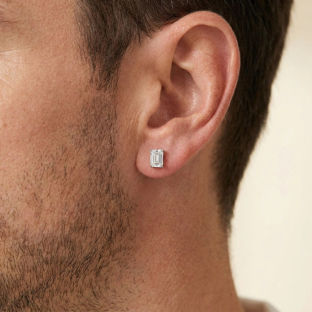 Man wearing an emerald cut moissanite stud earring in white gold - Sensitive Stones