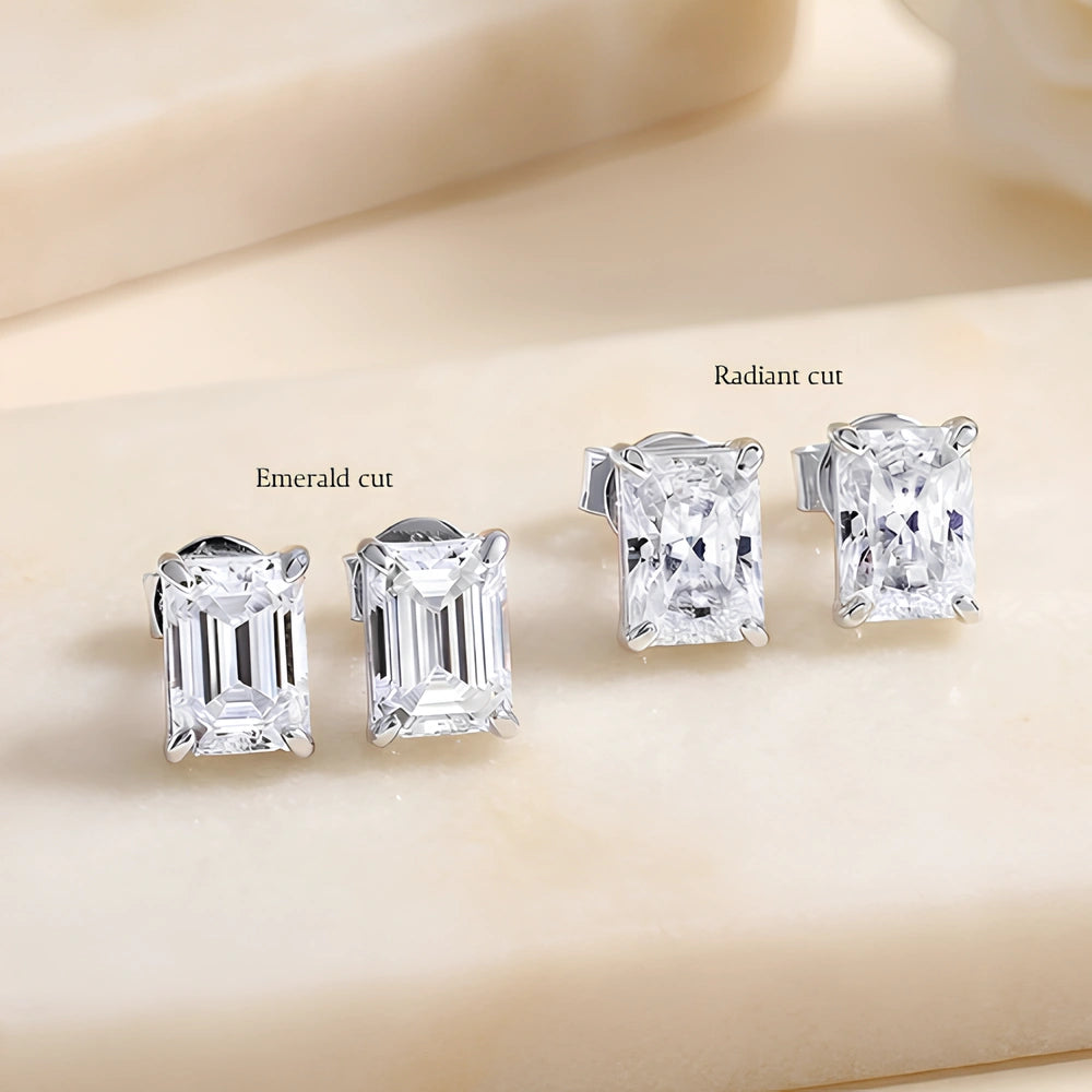 Emerald cut and radiant cut moissanite stud earrings compared side by side in white gold - Sensitive Stones