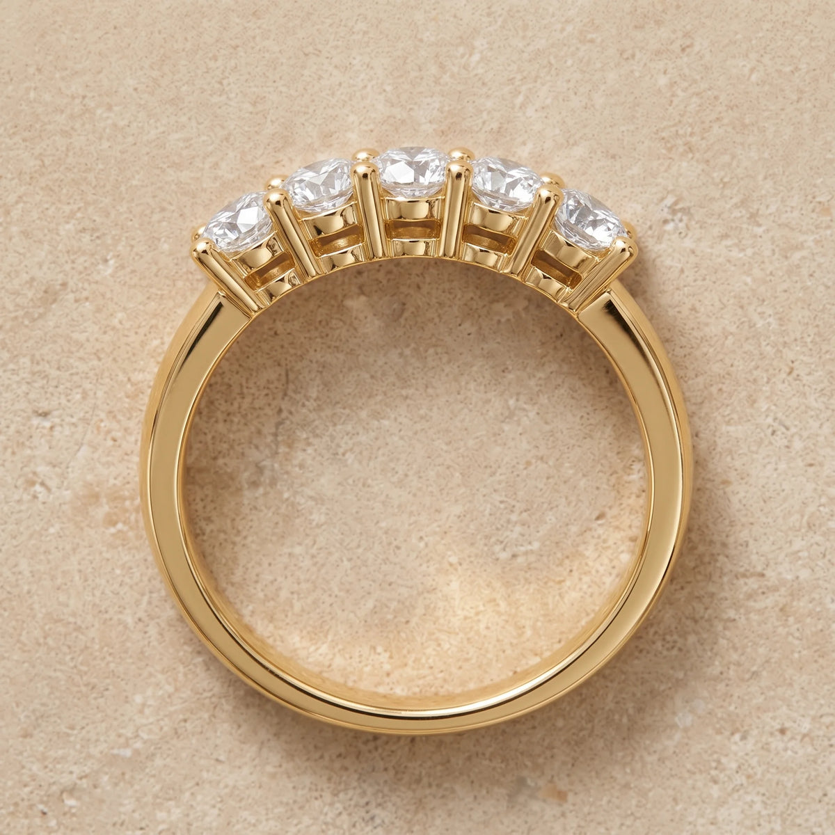 Front view of the five stone moissanite stackable ring in 14K gold filled, showing the shared prong setting and low band profile - Sensitive Stones