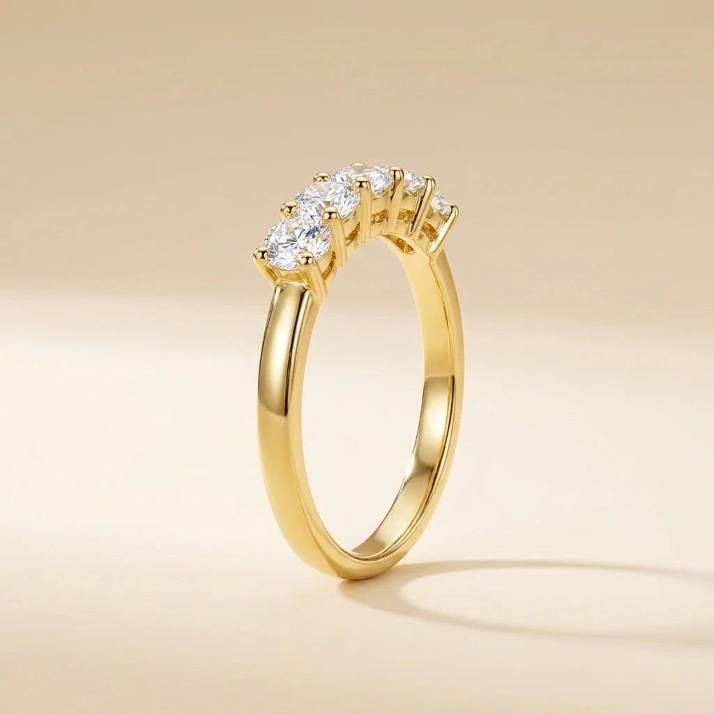 Side profile of the five stone moissanite wedding band in yellow gold showing prong settings - Sensitive Stones