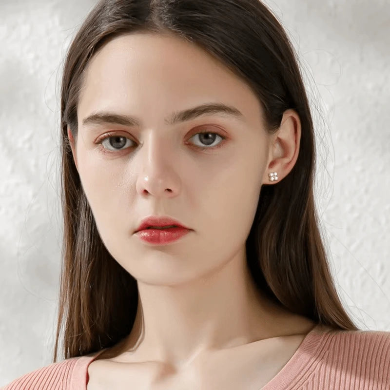 Four leaf clover moissanite stud earrings in 925 sterling silver with rose gold plating worn on model with D color VVS1 moissanite – Sensitive Stones