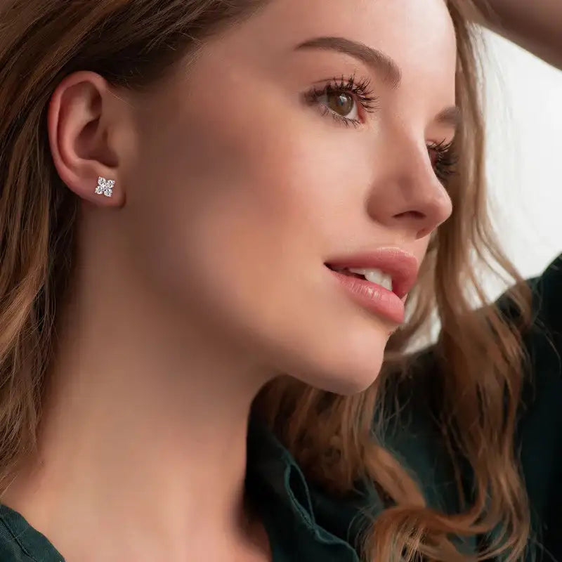 Model wearing yellow gold moissanite clover stud earrings, elegant minimalist jewelry look – Sensitive Stones