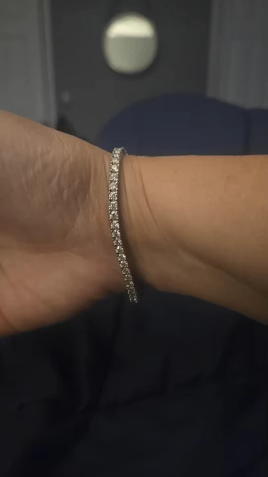 Sterling silver moissanite tennis bracelet showcased in casual everyday wear setting.