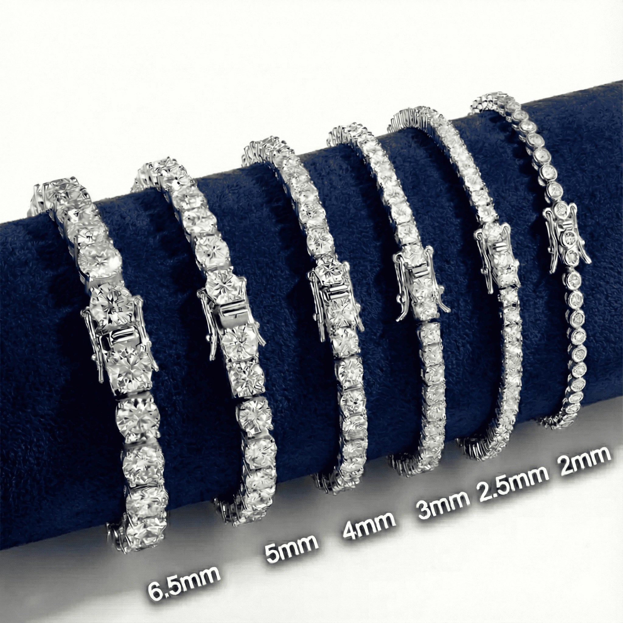 Set of white moissanite tennis bracelets with size measurements on a velvet holder - Sensitive Stones