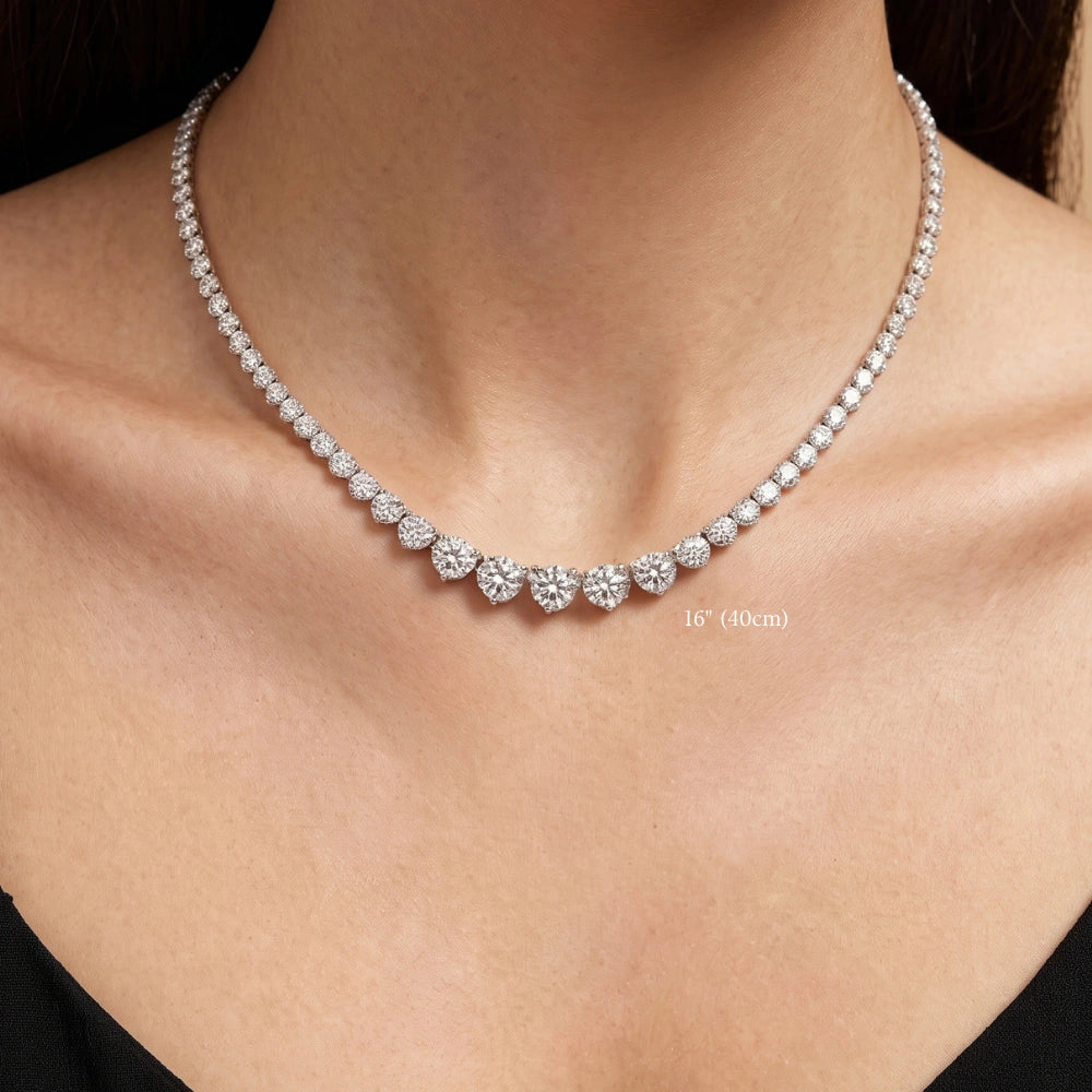 Graduated moissanite tennis necklace worn at 16in (40cm), resting at the collarbone