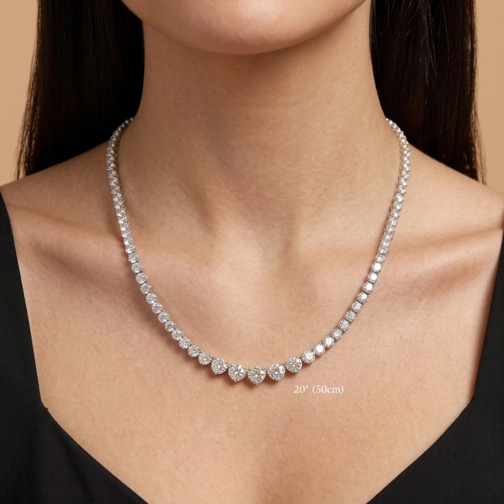Graduated moissanite tennis necklace worn at 20in (50cm), sitting lower on the chest