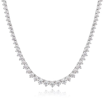 Graduated moissanite tennis necklace in 925 sterling silver with 18K white gold plating, stones rising from 3mm at the nape to 4.5mm at the centre