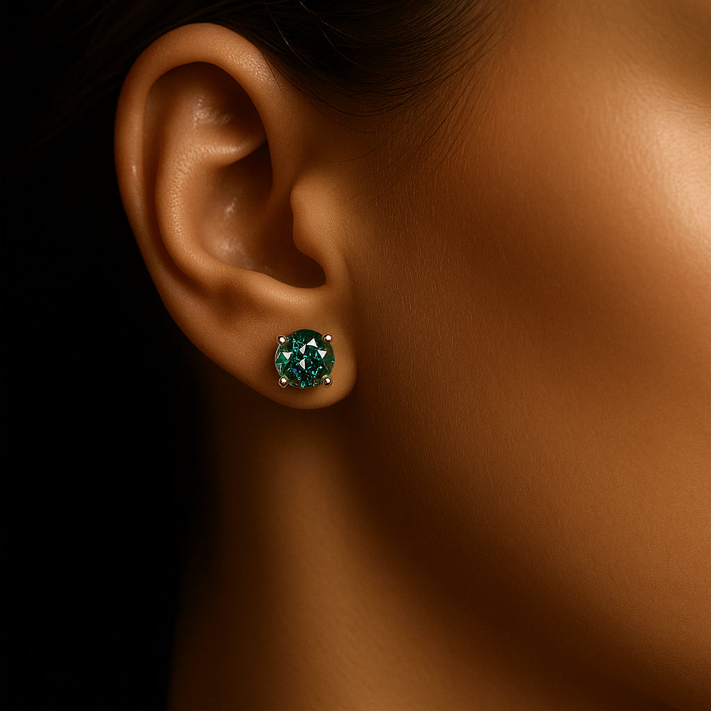 Close-up of a green moissanite stud earring worn on a woman's ear, round cut, 4-prong setting - Sensitive Stones