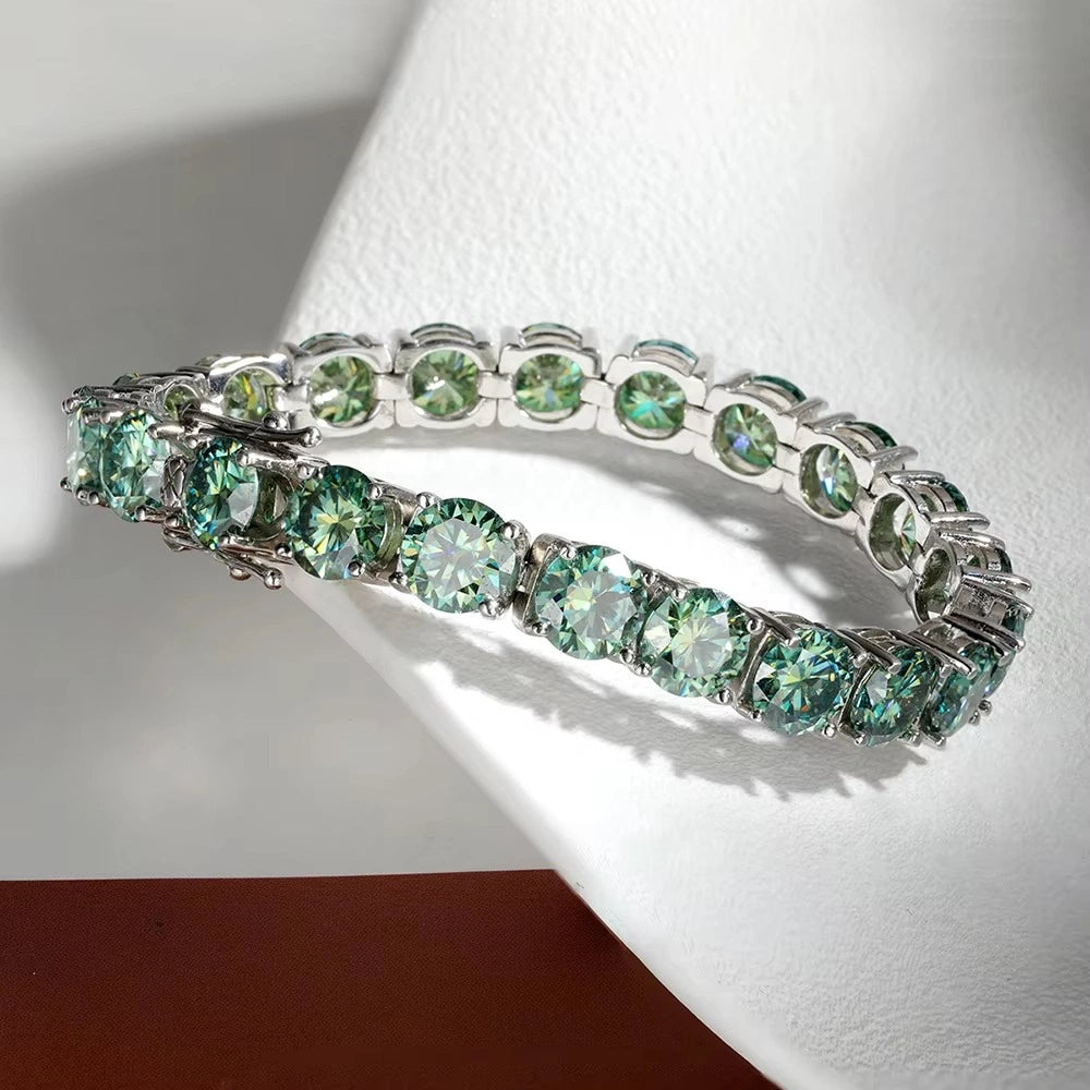 Green moissanite tennis bracelet in 925 sterling silver close-up lifestyle shot showing stone brilliance and 4-prong setting - Sensitive Stones