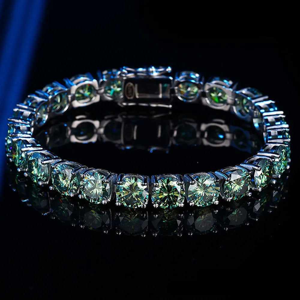 Green moissanite tennis bracelet with round cut stones in sterling silver 4-prong setting on black background - Sensitive Stones