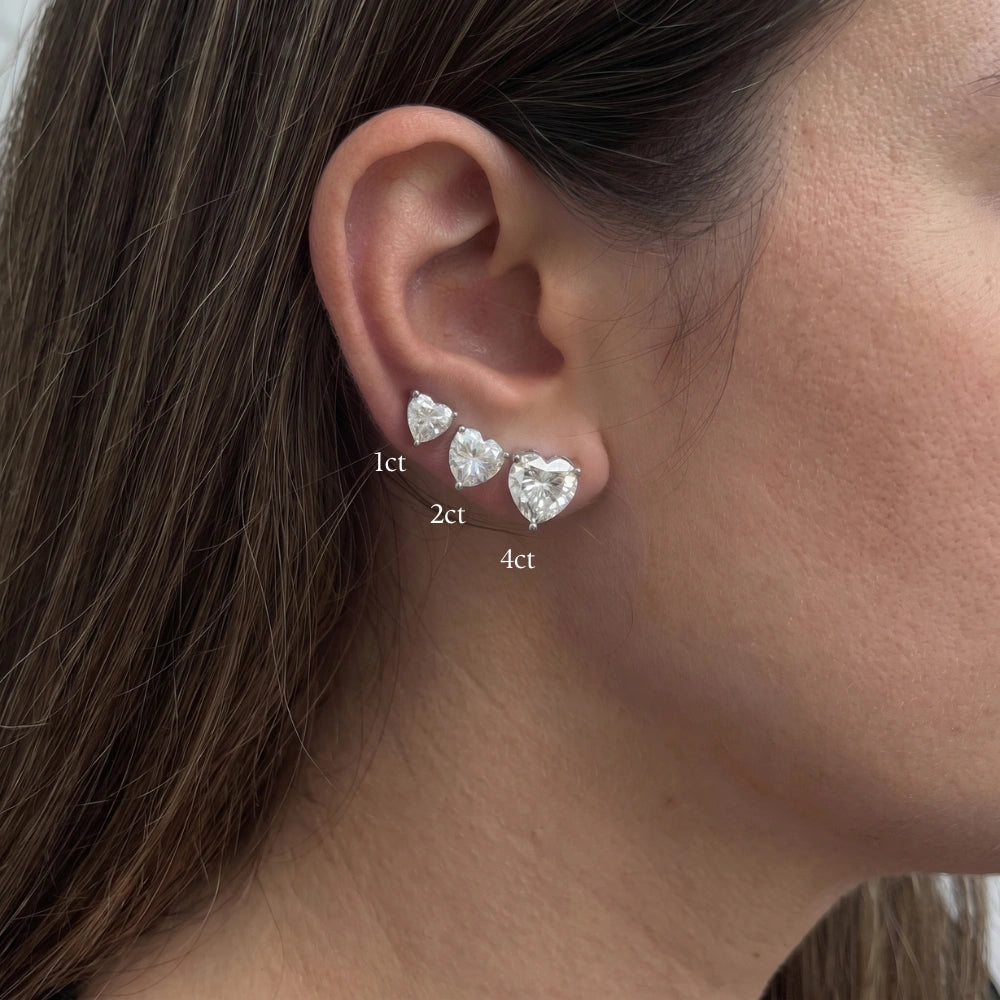 Heart cut moissanite stud earrings size comparison on the ear, 1ct 2ct and 4ct in white gold - Sensitive Stones