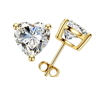 Heart cut moissanite stud earrings with 18K yellow gold prongs on a white background - Sensitive Stones