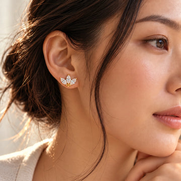 Lotus marquise moissanite stud earring in 14K gold filled worn on the ear, shown on a model for scale - Sensitive Stones