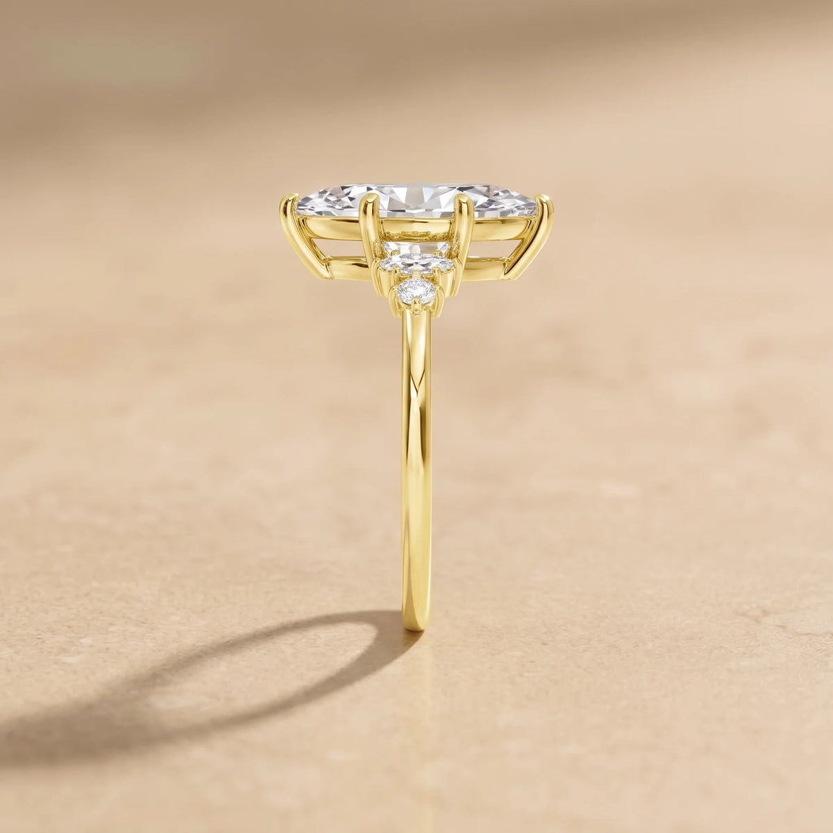 Side profile of a 14K gold filled marquise moissanite engagement ring showing the slim band