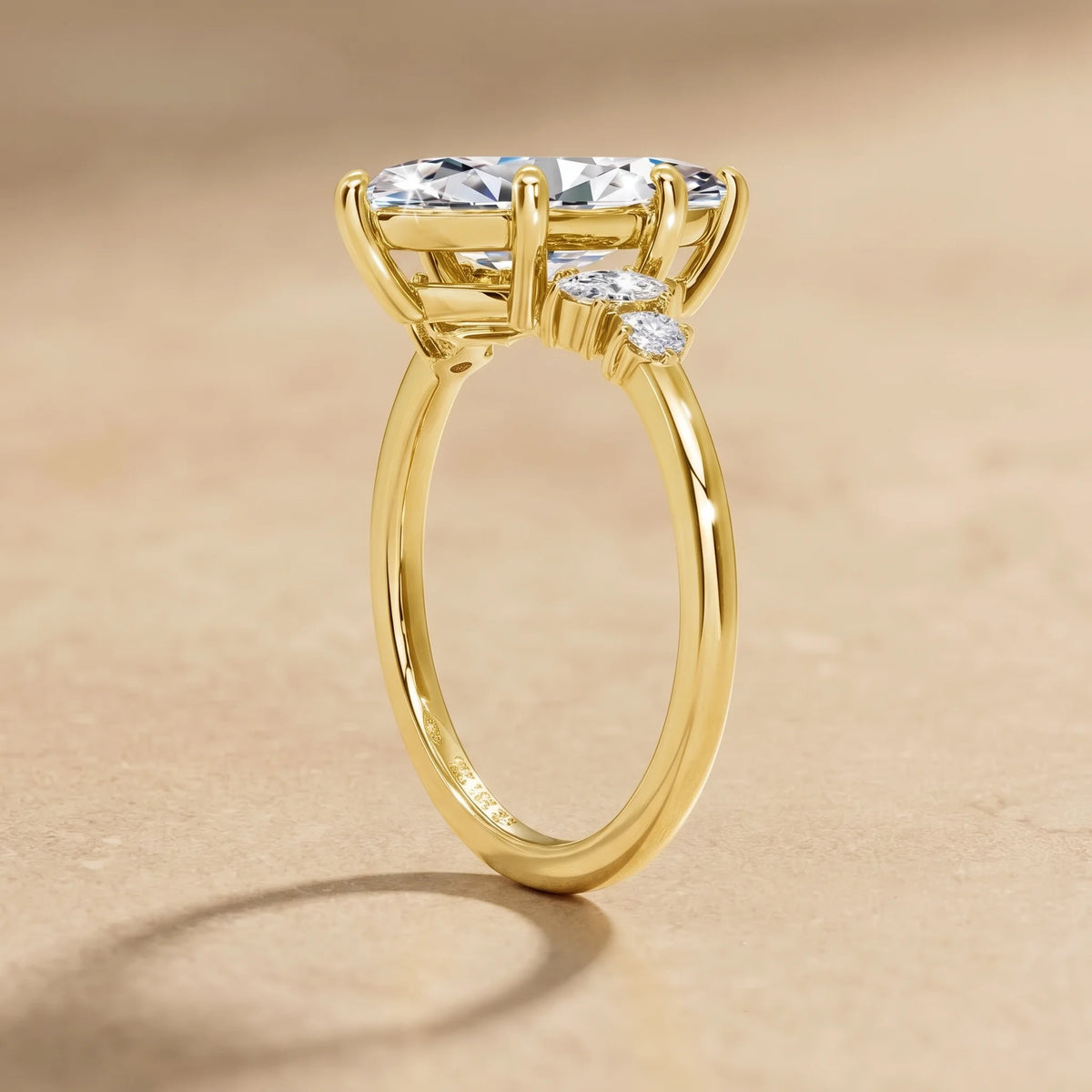 Close up of the marquise and round moissanite side stones on a 14K gold filled engagement ring