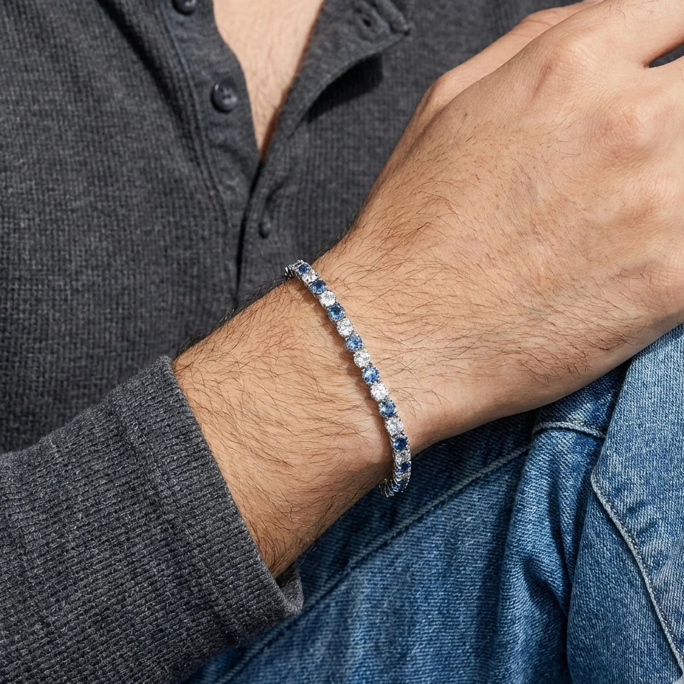 Man wearing alternating blue and white moissanite tennis bracelet 925 sterling silver round-cut stones casual lifestyle - Sensitive Stones