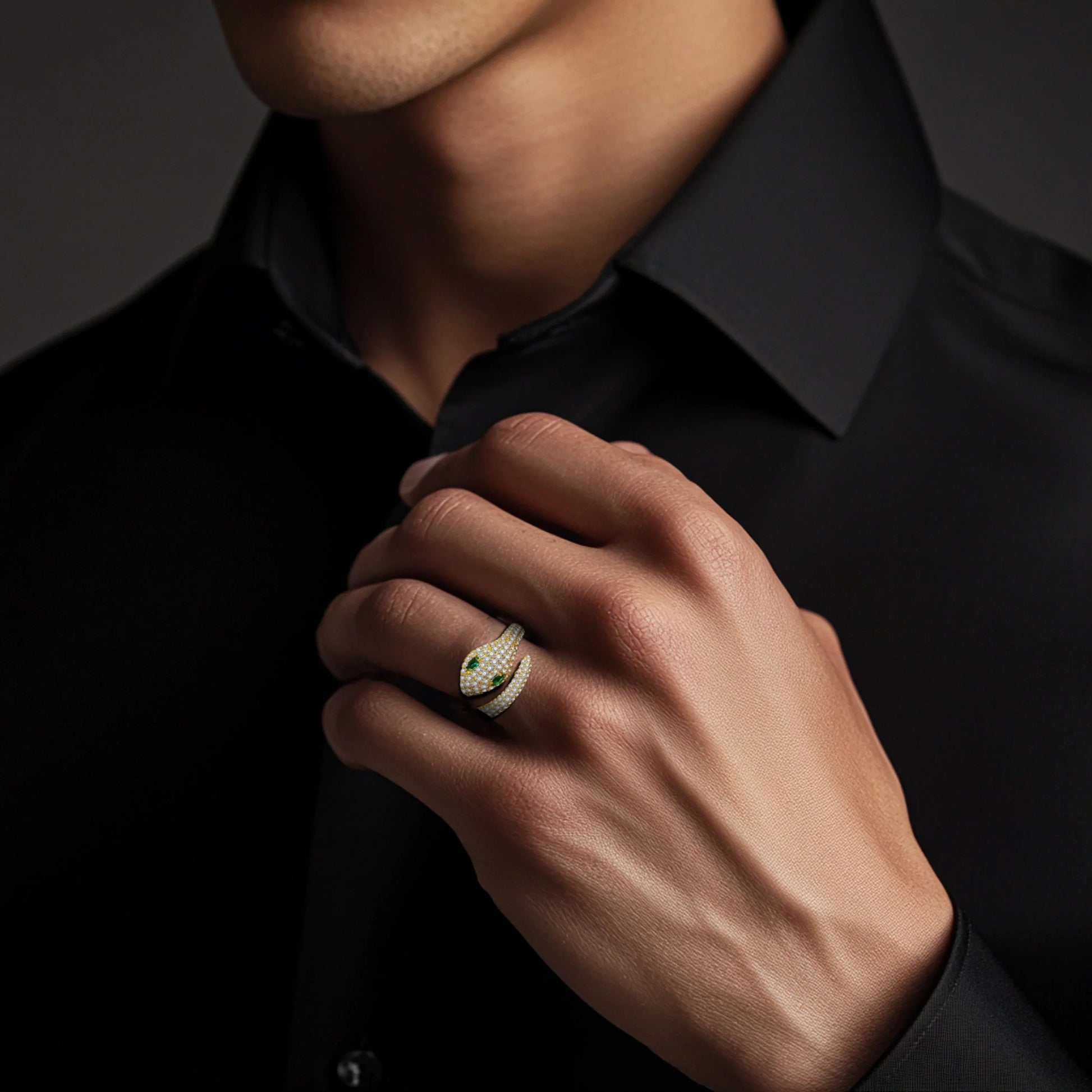 Man wearing moissanite snake ring with green gemstone eyes, unisex serpent jewelry design | Sensitive Stones