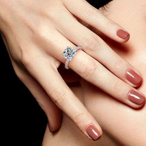 Model wearing D-Color Moissanite Engagement Ring – solitaire round cut with pavé CZ band, 18K white-gold plated silver – Sensitive Stones