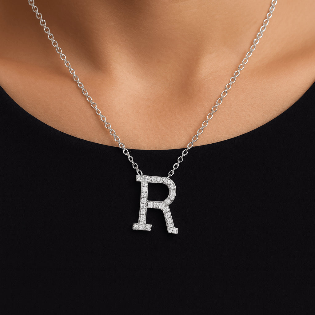 Model wearing lab-created moissanite initial ‘R’ necklace on 925 sterling silver cable chain with white gold and rhodium plating - Sensitive Stones