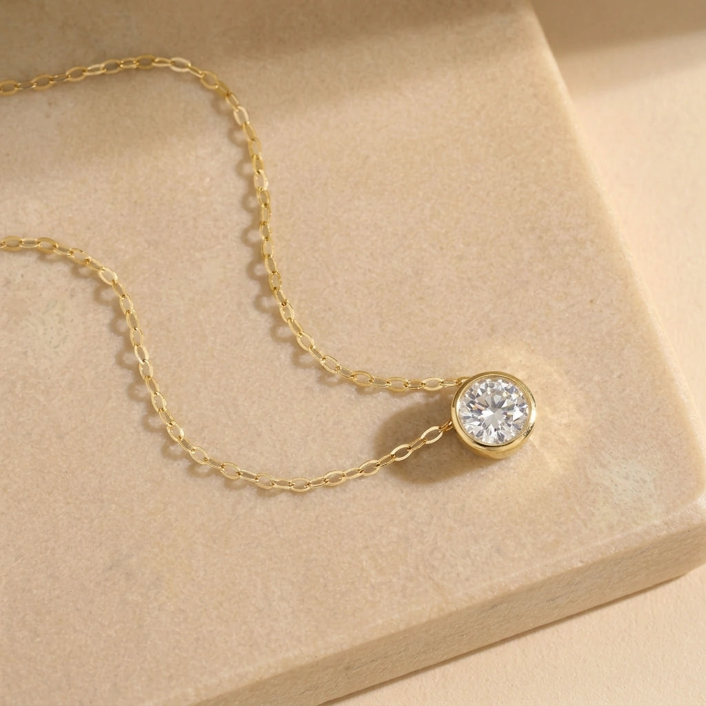 14K gold filled bezel moissanite necklace laid flat showing the fine O-chain - Sensitive Stones