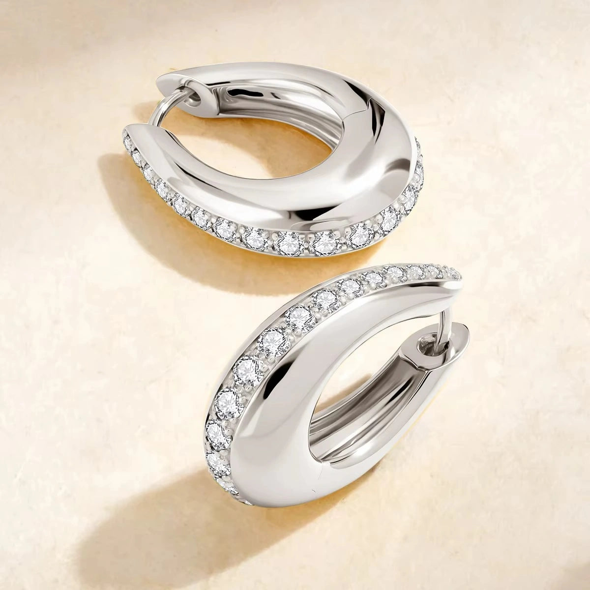 Moissanite chunky pavé hoop earrings in 925 sterling silver product flat lay showing continuous pavé edge and hinged closure - Sensitive Stones