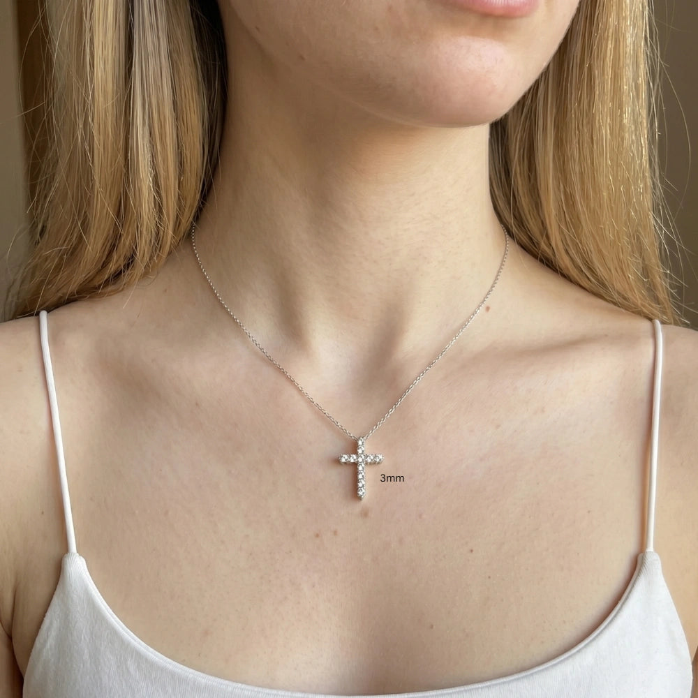 3mm moissanite cross pendant necklace in 925 sterling silver worn on model with white top, delicate everyday size - Sensitive Stones