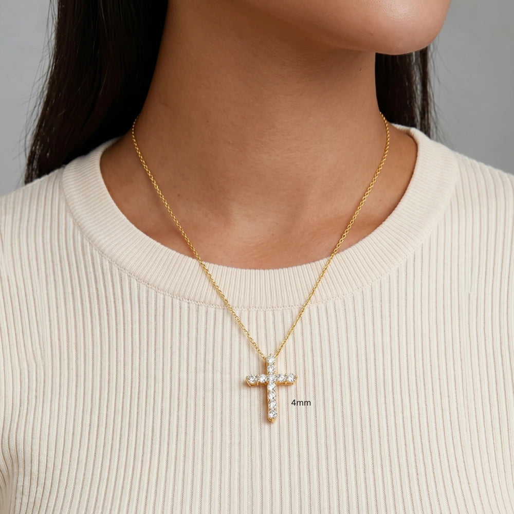 4mm moissanite cross pendant necklace in 925 sterling silver and 18k gold finish worn on model with cream top - Sensitive Stones