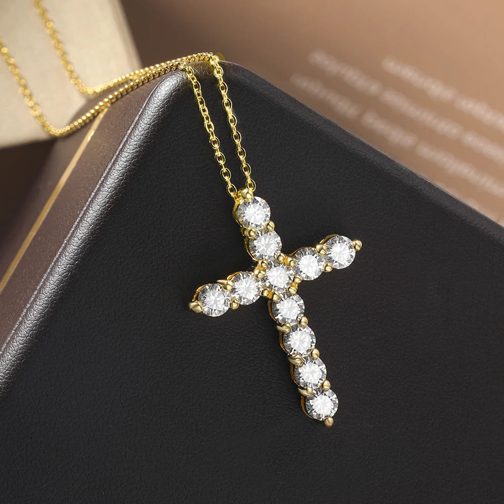Moissanite cross necklace with D color VVS1 stones in 925 silver with 18k gold finish hanging in a black jewelry box - Sensitive Stones