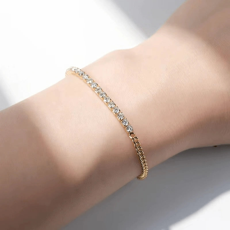 Yellow gold plated sterling silver moissanite half tennis bracelet on wrist with sunlight reflection – Sensitive Stones
