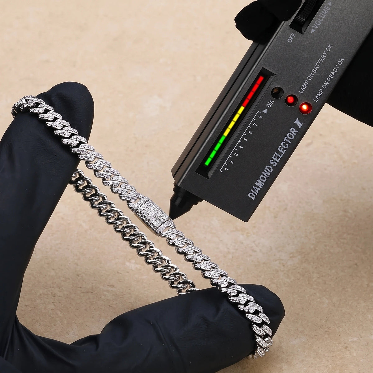 White gold moissanite Cuban link bracelet reading in the diamond zone on a handheld diamond tester
