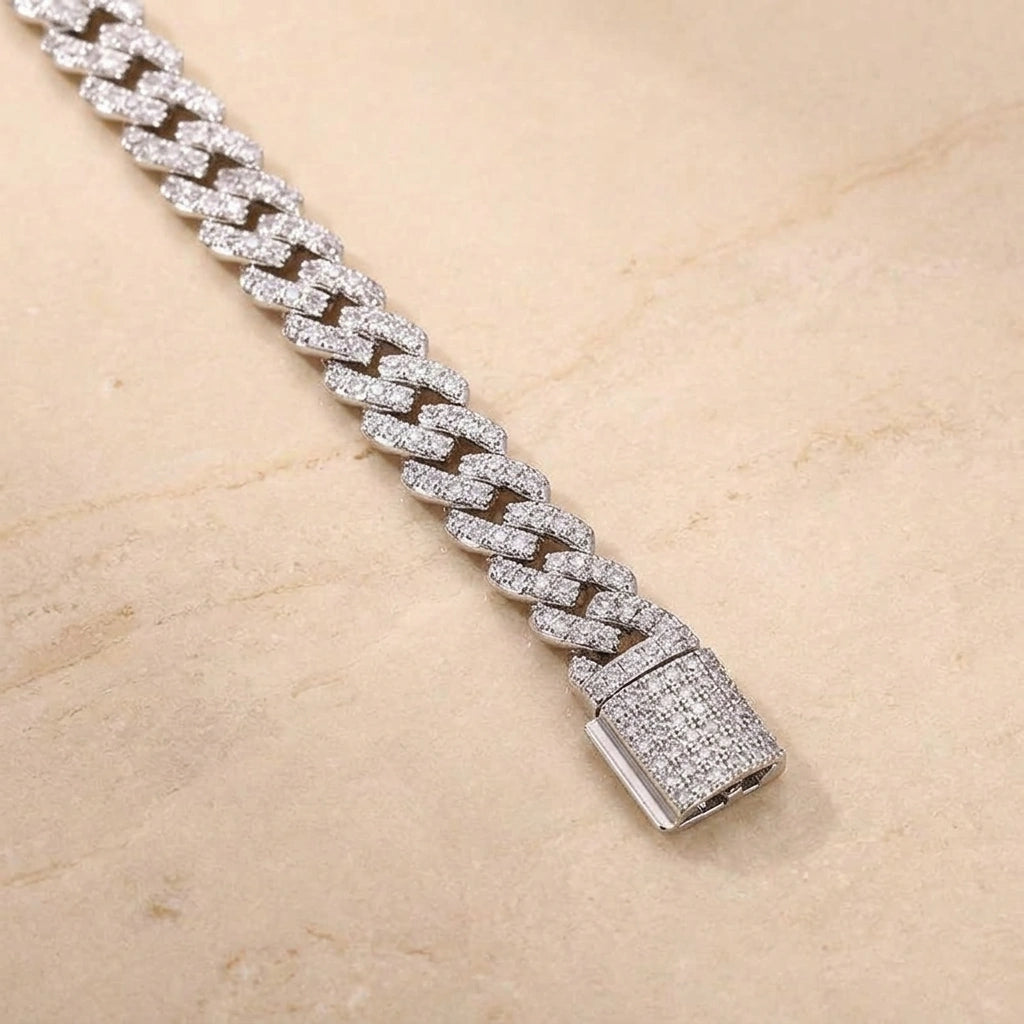 Close-up of the pave box clasp on a white gold moissanite Cuban link bracelet