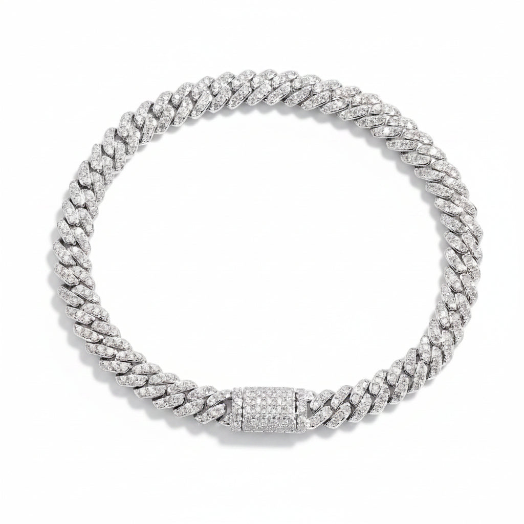 6mm moissanite Cuban link bracelet in white gold laid flat, pave set on every link with a matching box clasp