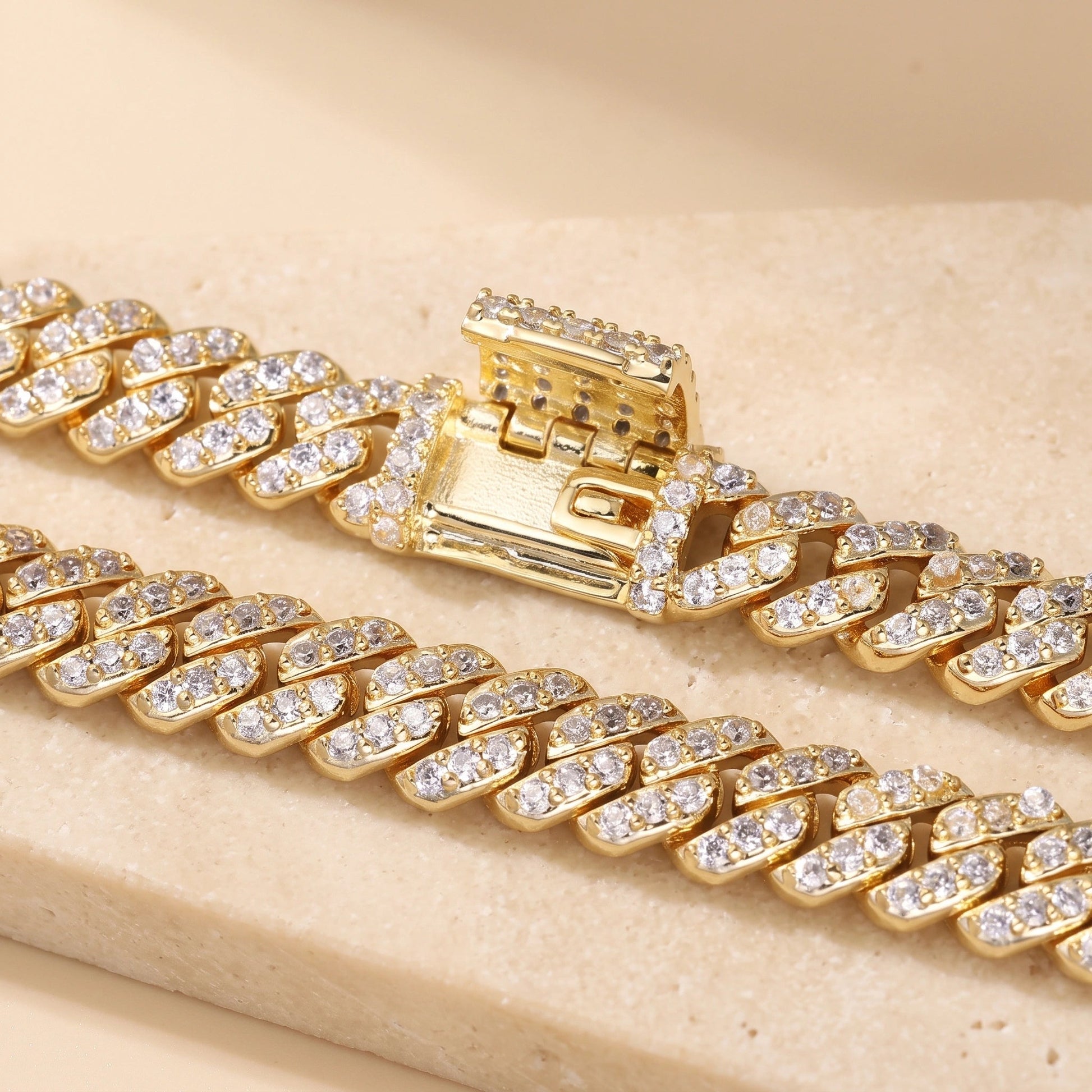 Yellow gold moissanite Cuban link bracelet with the tongue-and-box clasp open, showing the mechanism