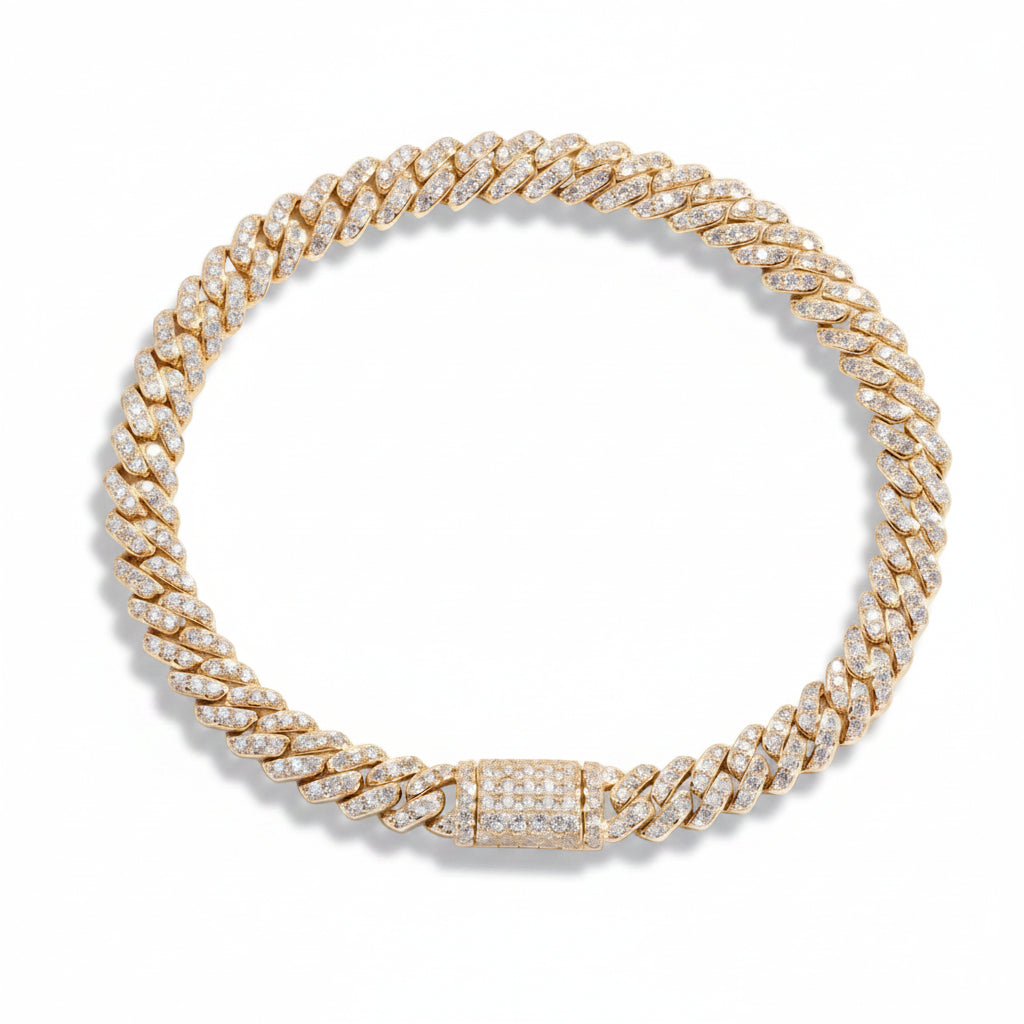 6mm moissanite Cuban link bracelet in yellow gold laid flat, pave set on every link with a matching box clasp
