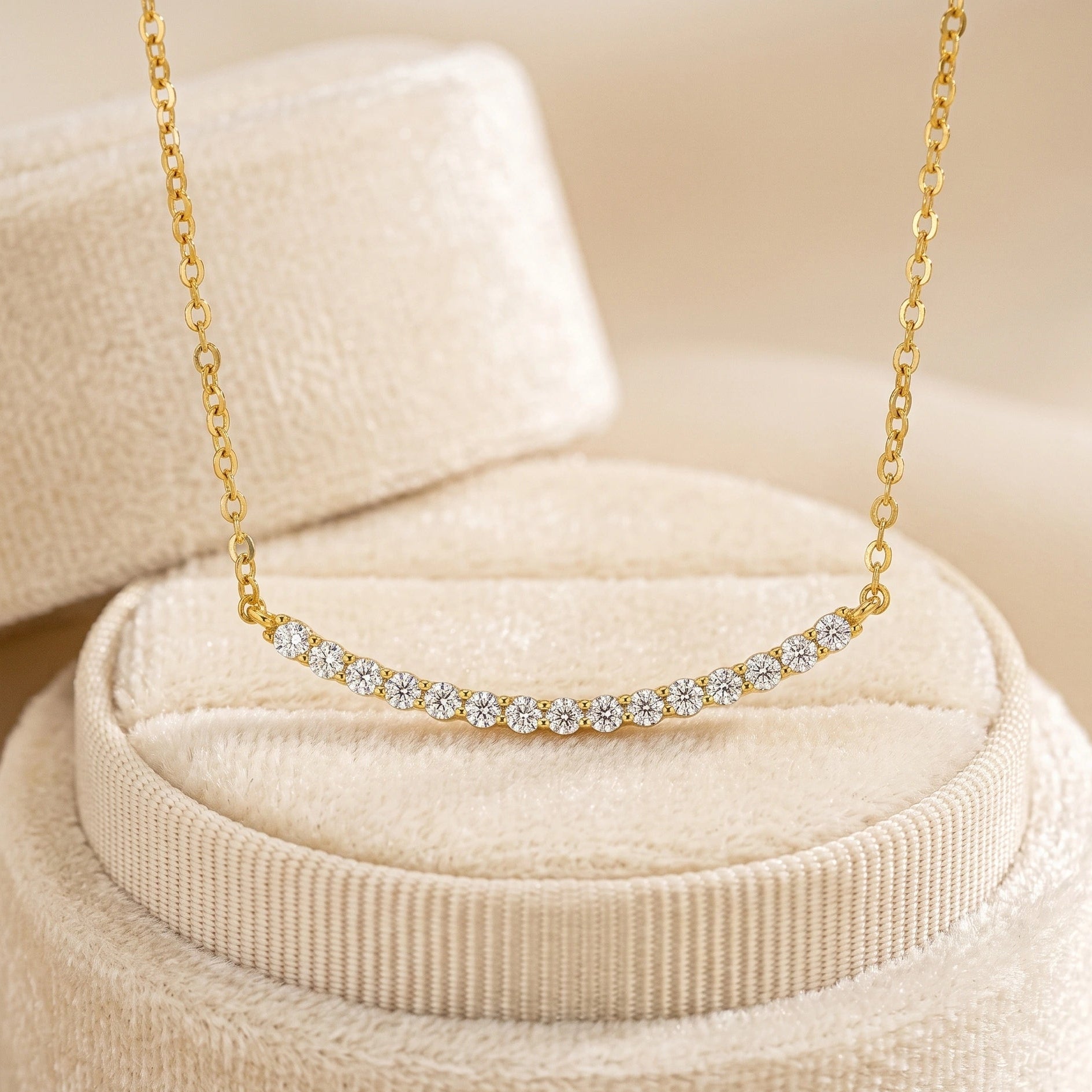 Moissanite curved bar necklace in 18K yellow gold on velvet jewelry box - Sensitive Stones