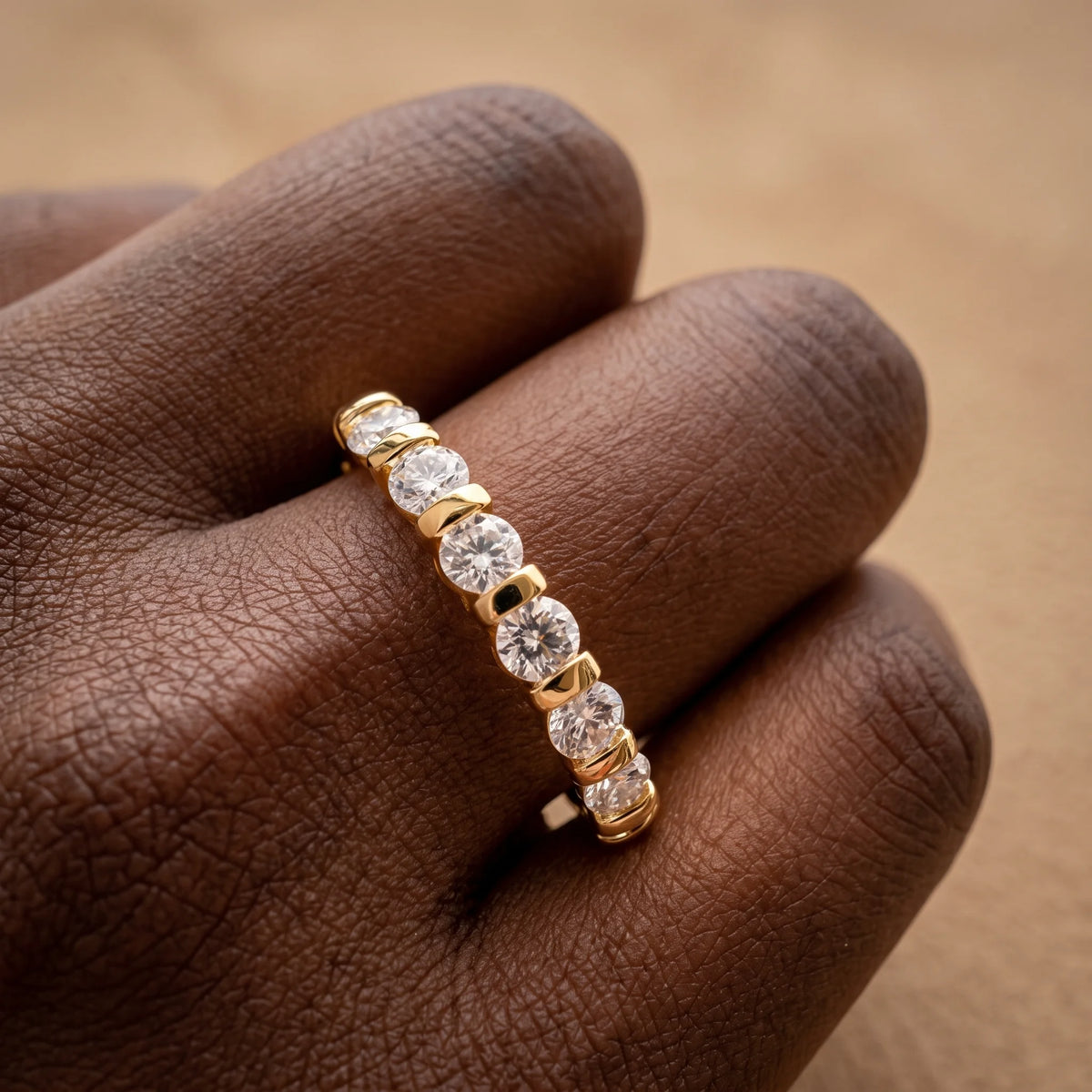 14K gold filled moissanite half eternity ring in yellow gold worn close up, seven bar-set 3mm round moissanite - Sensitive Stones