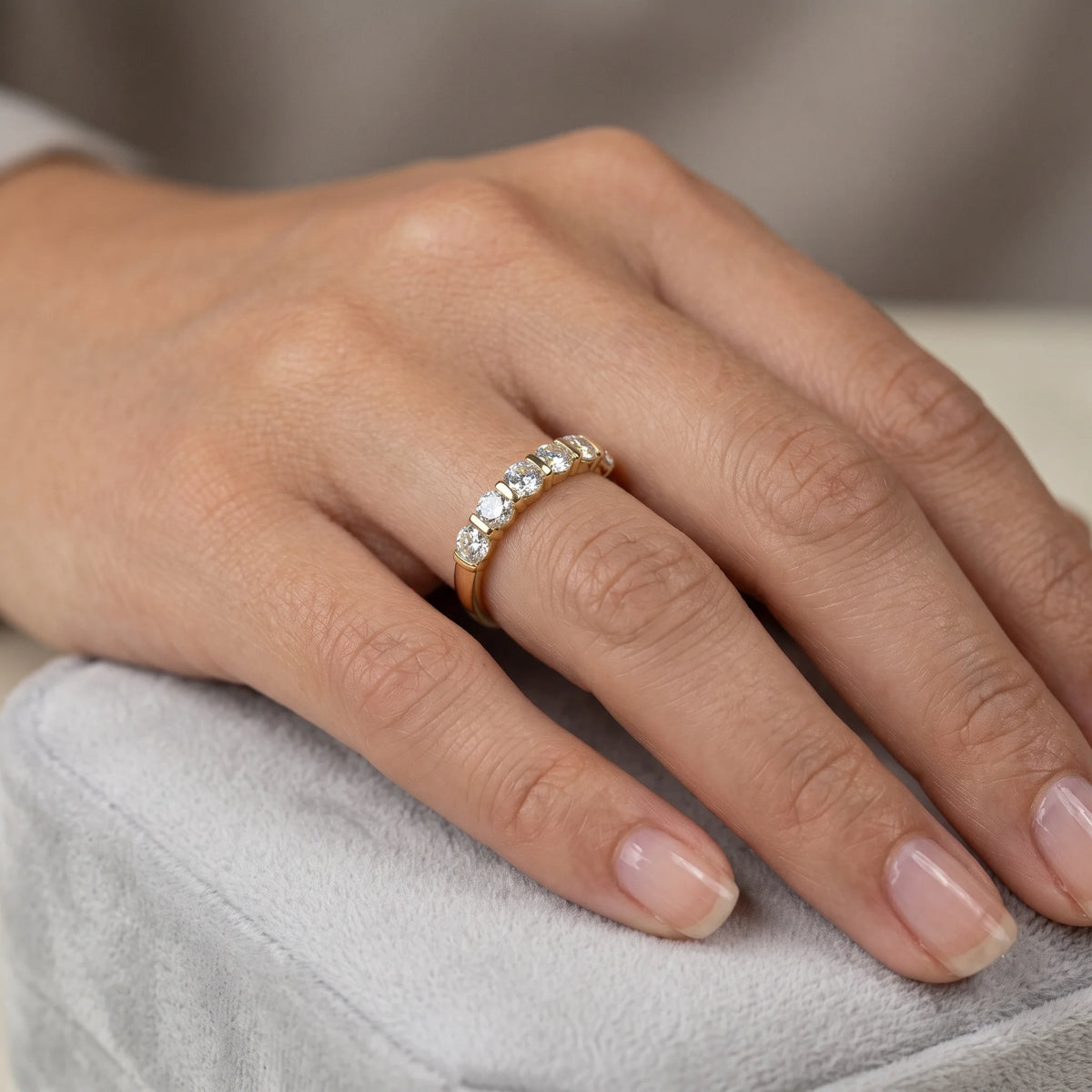 14K gold filled moissanite half eternity ring in yellow gold worn on the hand, everyday styling - Sensitive Stones