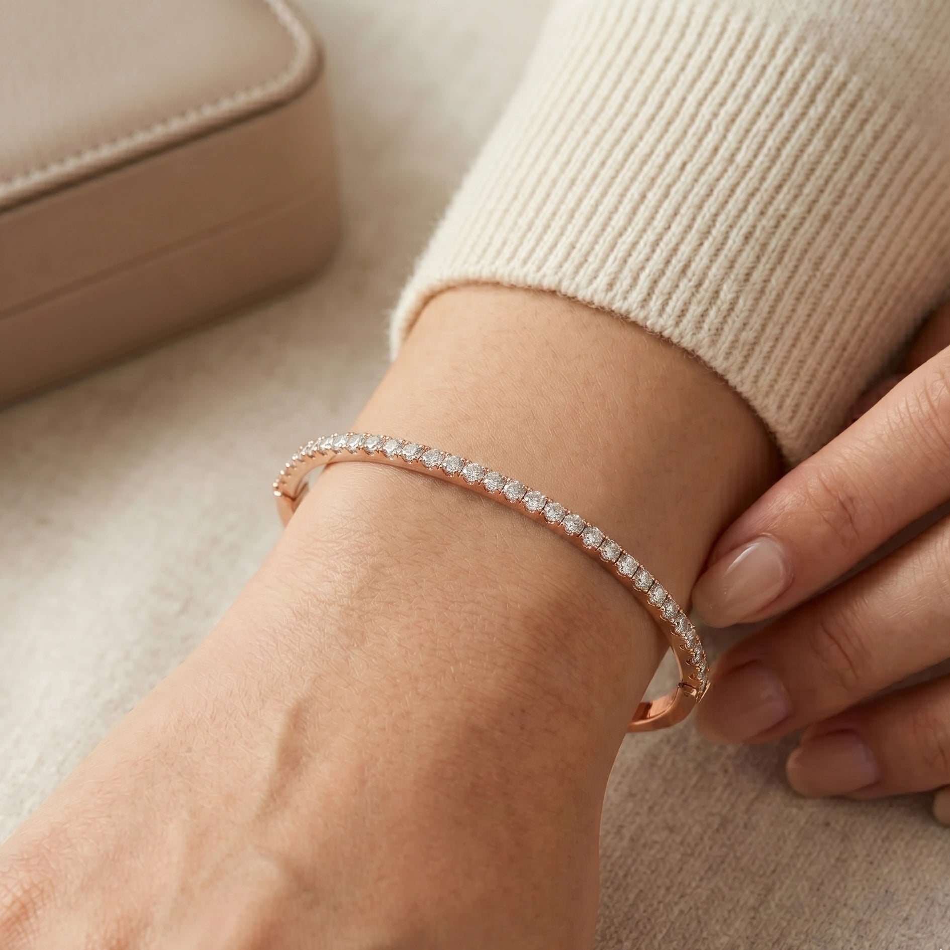 2.5mm moissanite half tennis bangle bracelet in 18K rose gold plating worn on wrist - Sensitive Stones