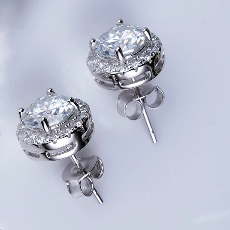 White moissanite halo stud earrings showing butterfly back clasp and 4-prong setting detail in 925 sterling silver - Sensitive Stones