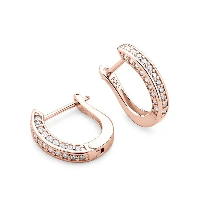 Moissanite huggie hoop earrings in a rose gold finish shown open to reveal the hinged closure and the S925 hallmark - Sensitive Stones
