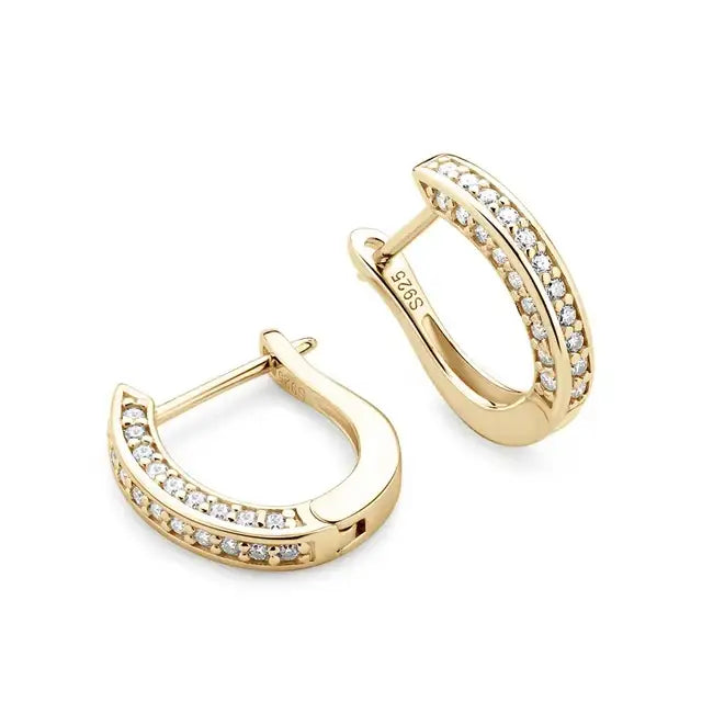 Moissanite huggie hoop earrings in a yellow gold finish shown open to reveal the hinged closure and the S925 hallmark - Sensitive Stones