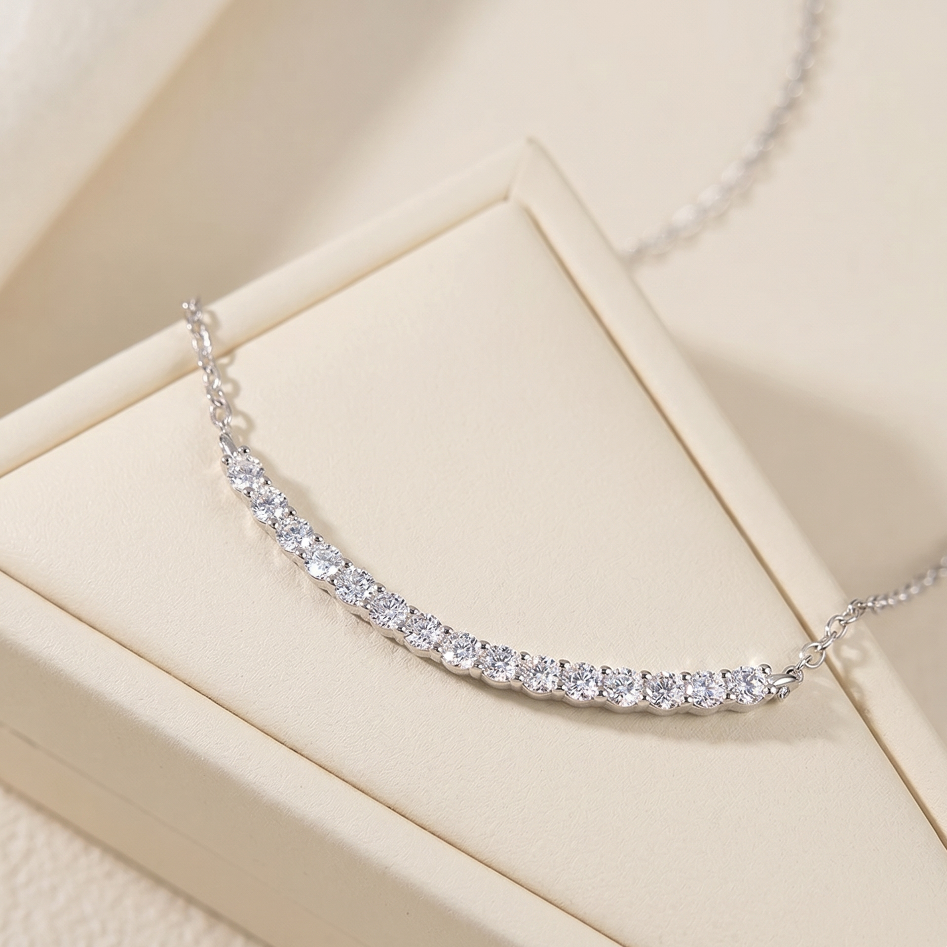 925 sterling silver moissanite smile bar necklace displayed on cream jewelry tray -  Sensitive Stones