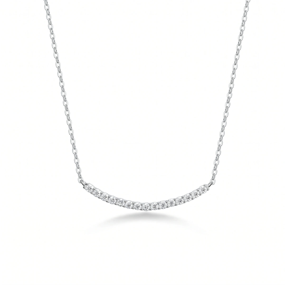 Moissanite smile bar necklace in 925 sterling silver with a white gold finish showing the curved bar of 15 prong-set 2.5mm stones on a fine cable chain - Sensitive Stones