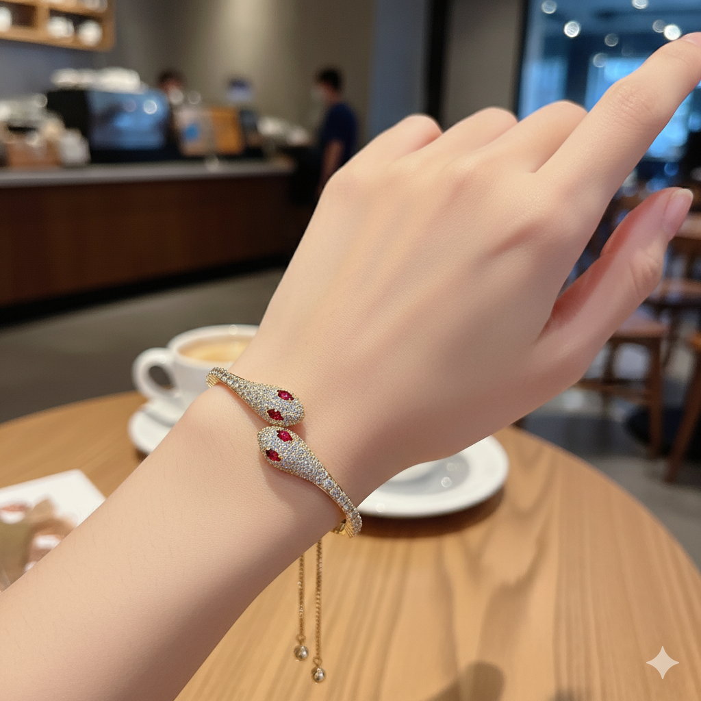 Model wearing gold plated double head moissanite snake bracelet with red cubic zirconia accents – Sensitive Stones